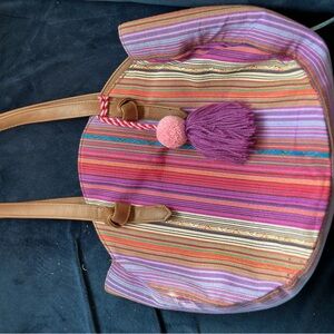 JULY SALE!!! Purple striped round handbag with tassel.